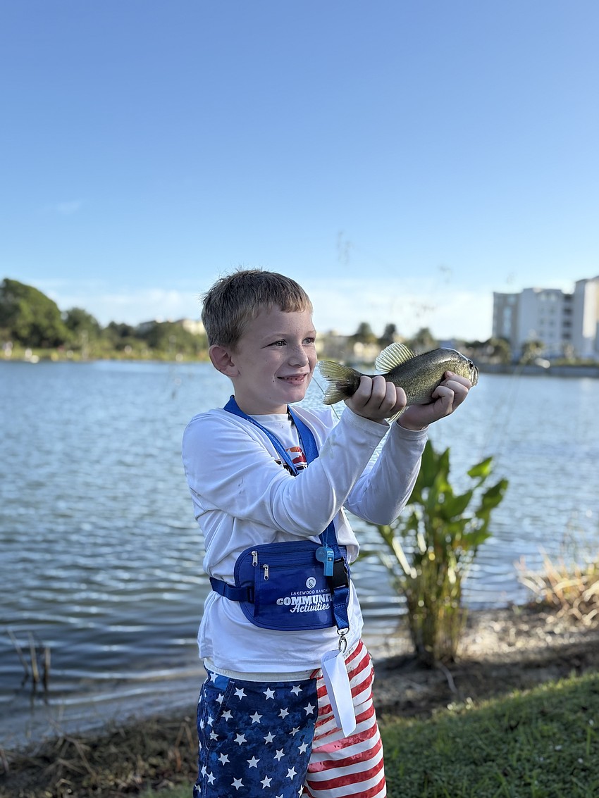 Lakewood Ranch's 7-year-old Jacob Zelkowski catches three fish before the tournament starts.