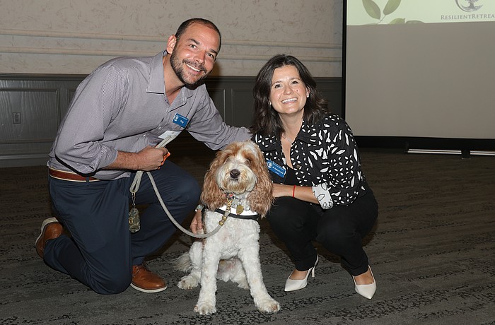 Troy and Dr. Sidney Turner with Resilient Retreat's famous therapy dog, Journey.