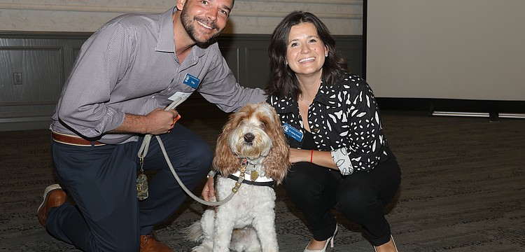 Troy and Dr. Sidney Turner with Resilient Retreat's famous therapy dog, Journey.