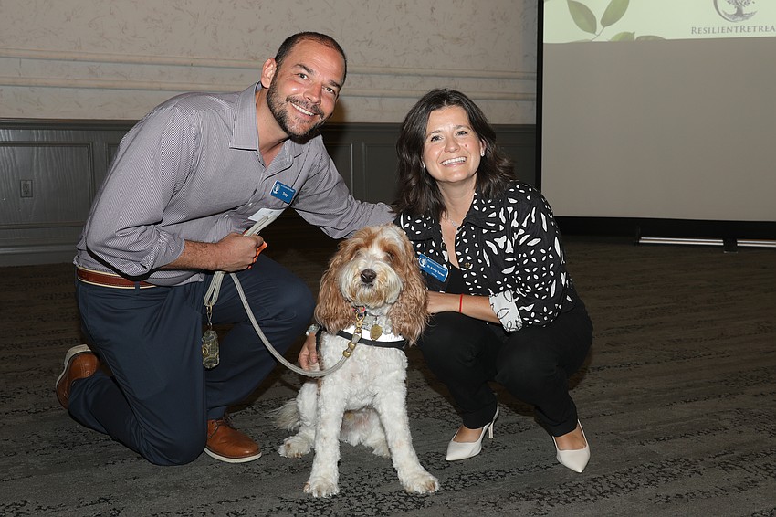 Troy and Dr. Sidney Turner with Resilient Retreat's famous therapy dog, Journey.