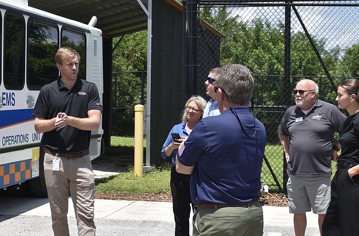 Gordon Folkes (on the left) explains how the drone works to members of the Lakewood Ranch Business Alliance in August 2024.