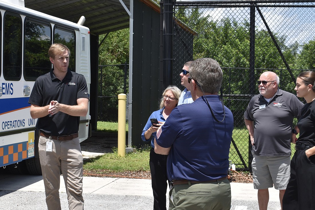 Gordon Folkes (on the left) explains how the drone works to members of the Lakewood Ranch Business Alliance in August 2024.
