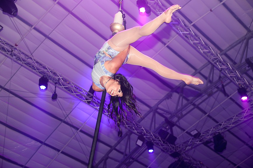 About 700 guests watch overhead as aerialist Emma Clarke performs at Wonderball 2025.