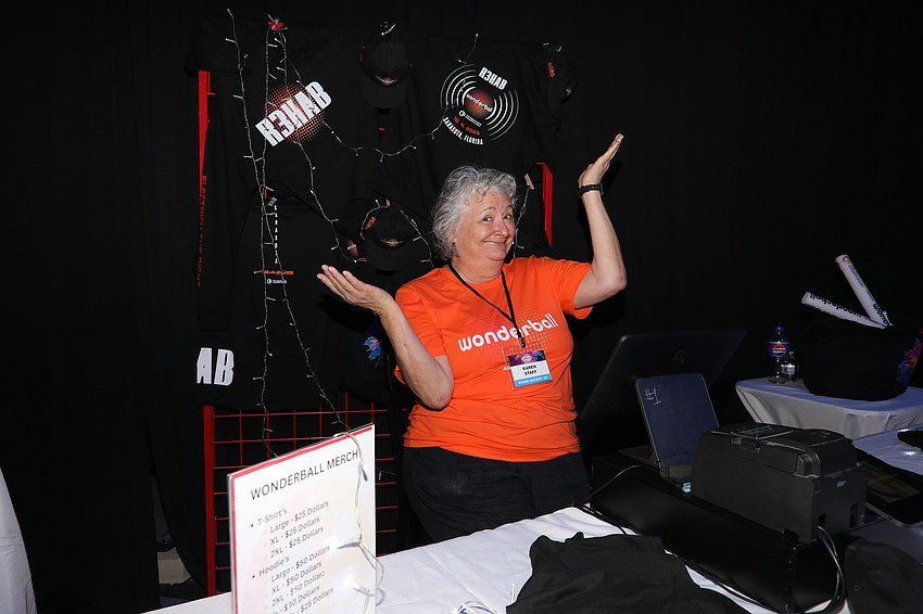 Karen Bell runs the merch table at the third annual Wonderball featuring the DJ R3HAB.