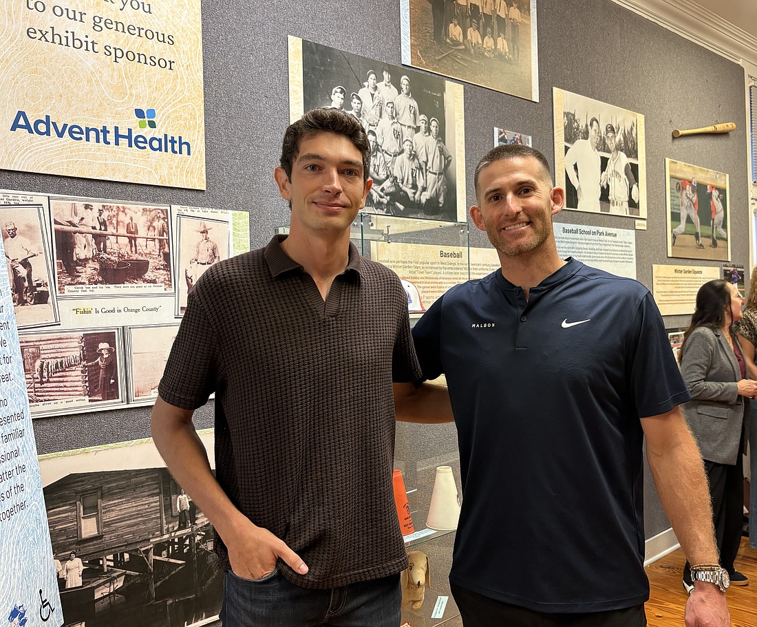 Racing professional Kyle Masson, left, and former Major League Baseball player Brad Miller were the guest speakers at the opening reception of “Champions of West Orange County: A Legacy of Athletic Excellence” at the Winter Garden Heritage Museum.