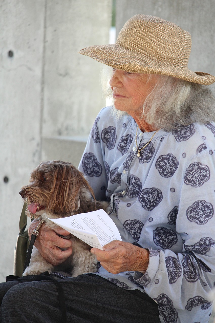 Leslie McLean and Misty the Havanese tune into St. Boniface Episcopal Church's pet blessing.