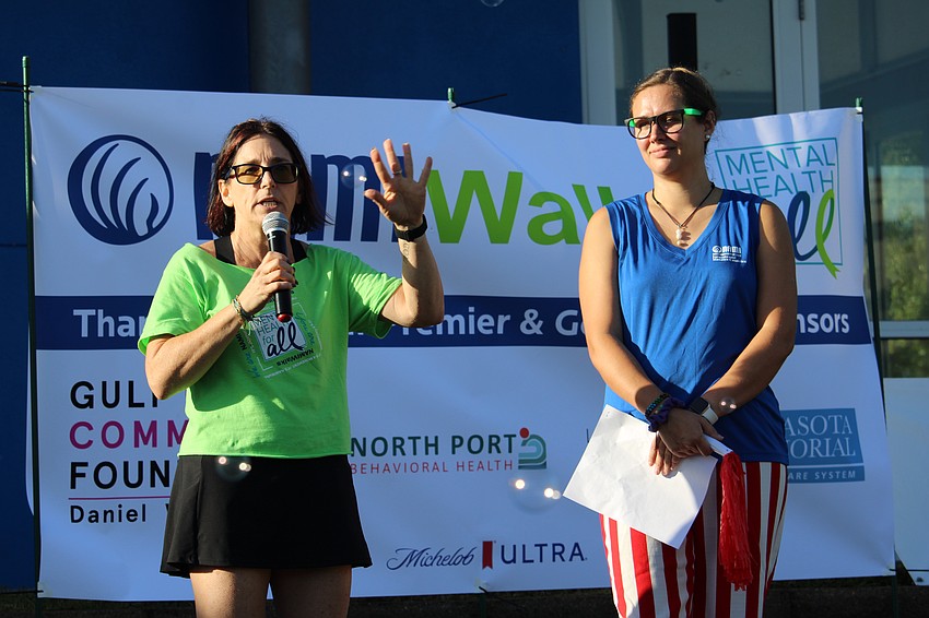 NAMI Sarasota and Manatee Counties CEO Colleen Thayer and NAMIWalks emcee Beth Walters welcome attendees to the opening of the 5th annual fundraiser.