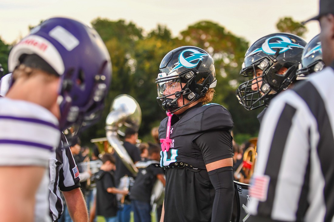 Olympia's captains waited for the coin toss against Celebration as the team kicked off Week 8 of high school football.