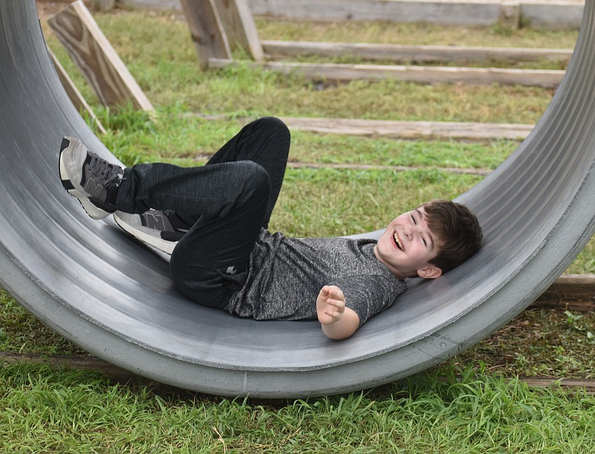 Palmetto's Isaiah Pyne, 9, needs a break after an eventful day at the Pumpkin Festival.
