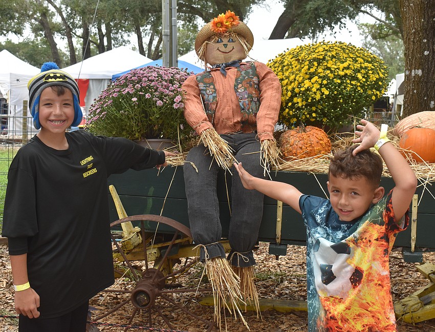 Bradenton brothers Raul Amaya, 10 and Xavier Amaya, 6, say the slides, bouncy houses and pumpkin cannon made for a day full of fun.