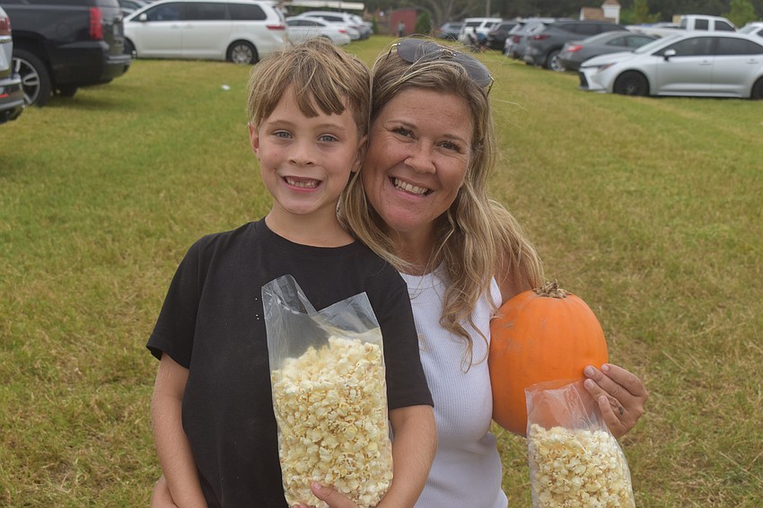 Cape Coral's Koda Randoll, 7 and Heather Martinez couldn't leave the festival without popcorn to go.