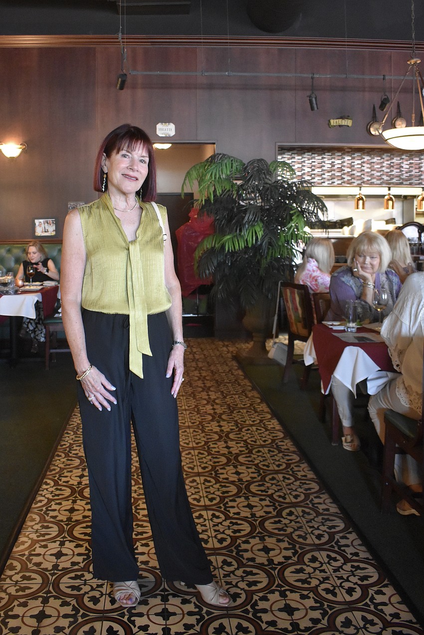 Palmetto's Debbie Reynolds models some of the fashions from Scout & Molly's Boutique.