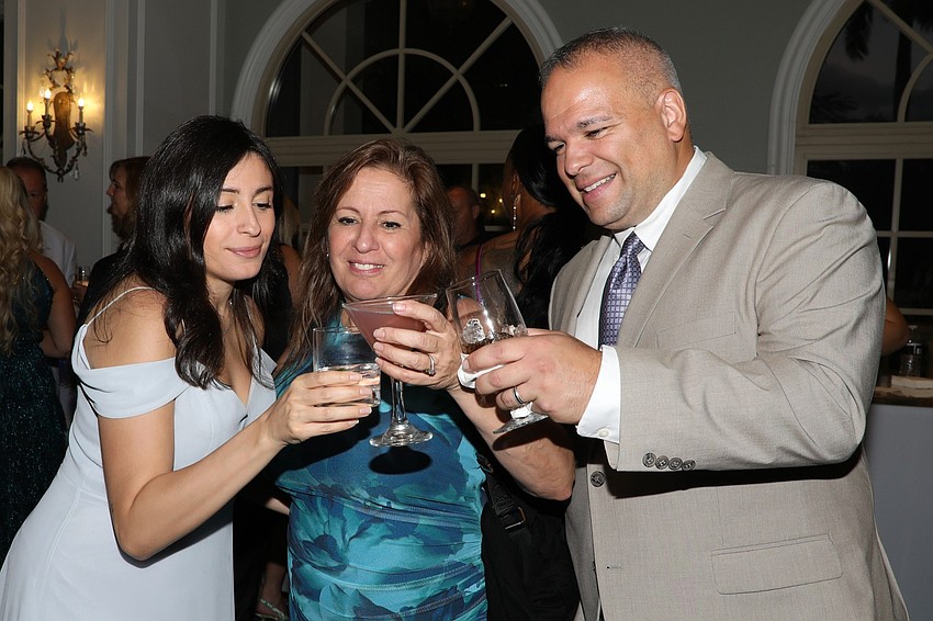 A toast between Michelle Lagrutta, mom Denise and cousin Vinny Micucci