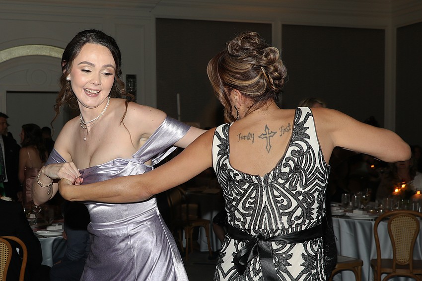 Mariah Branscum and Janelle Vincent-Whitaker enjoy a dance.