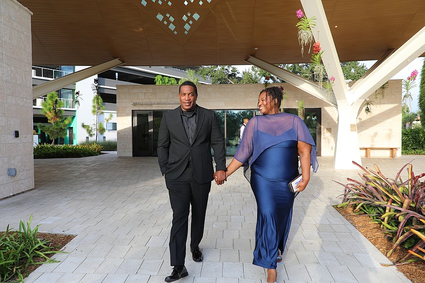 Kenny and Sherika Evans dazzle as they enter Marie Selby Botanical Gardens for the Taste of New Orleans.