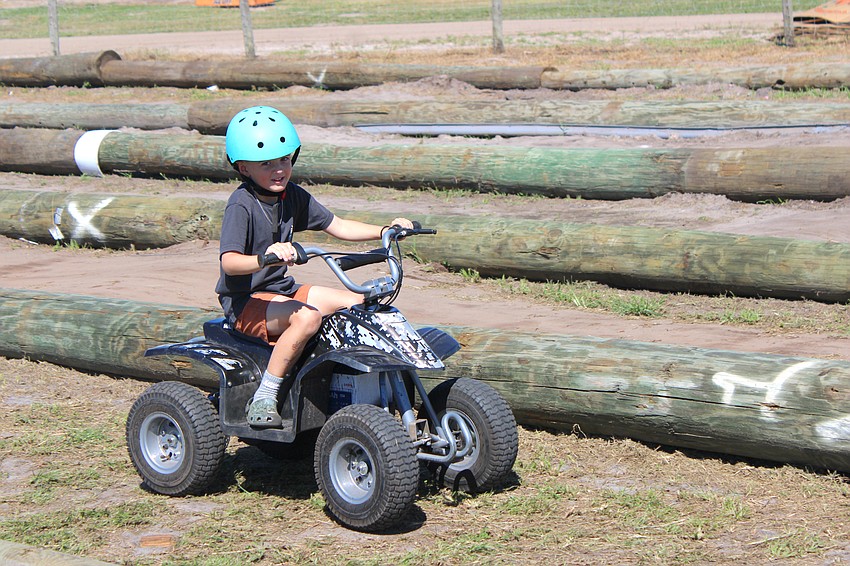 East County 5-year-old Cole Bailey checks out the cart course at Dakin's Harvest Festival in Myakka.