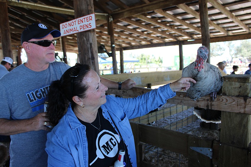 Lakewood Ranch's Rick and Kristen Emmons talk a little turkey at the Dakin Harvest Festival Oct. 12.