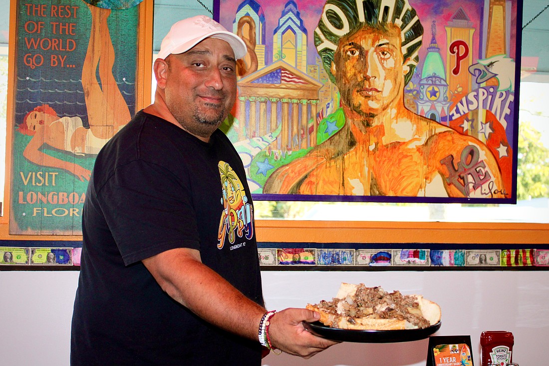 Robin Gupta, owner of Guppy's Longboat Key, said he's most proud of the way the restaurant has brought together people over lively conversation and hot cheesesteaks in its first year of operation.