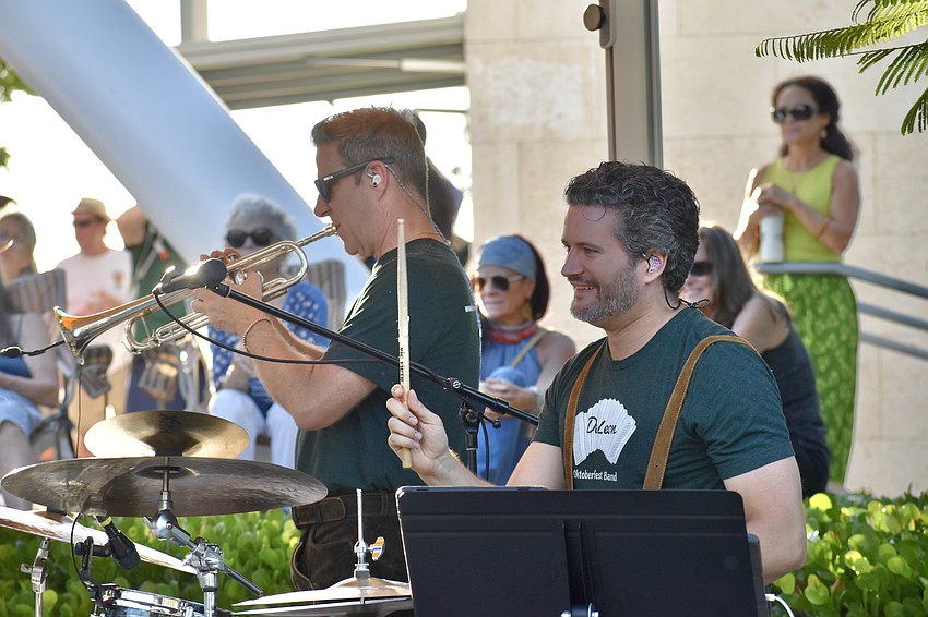 Jeff Wooldridge and Lance Cox of the DeLeon Oktoberfest Band perform on stage.