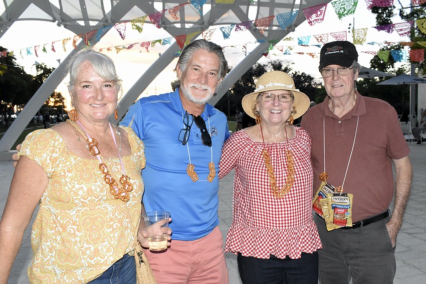 Karen and John Szkutnik, and Lee Ann and Steve Pond, wore pretzel necklaces and earrings made by Lee Ann Pond, who is Karen Szkutnik's sister.
