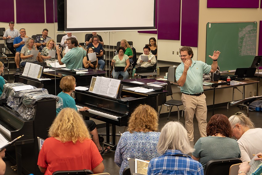 Bel Canto Singers Director Adam Stich rehearses with his choir. Courtesy photo