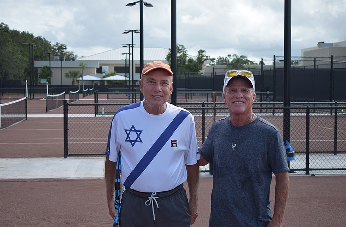 Larry Greenspon (left) and Paul Lederman (right) pose for a photo before a lesson on Oct. 10 at SunCourt Sports. Greenspon had a vision for the Jewish Federation of Sarasota-Manatee to create a junior tennis program for underserved youth in the area.