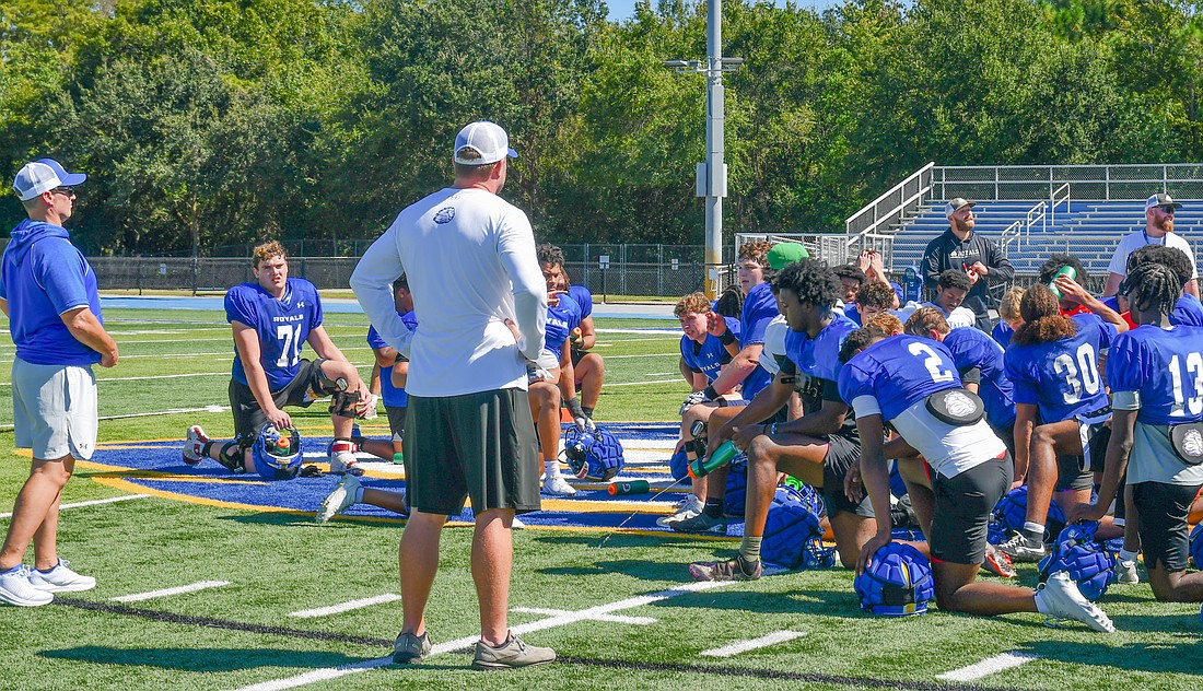 The First Academy took a moment to reflect on the highlights from practice. Coaches went around the circle to emphasize a player whose character stood out.