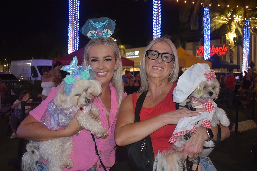 Sarasota's Olivia Gibson and dog Pixie went with a mermaid theme while Jessica Thomason and dog Summer went the chef route.