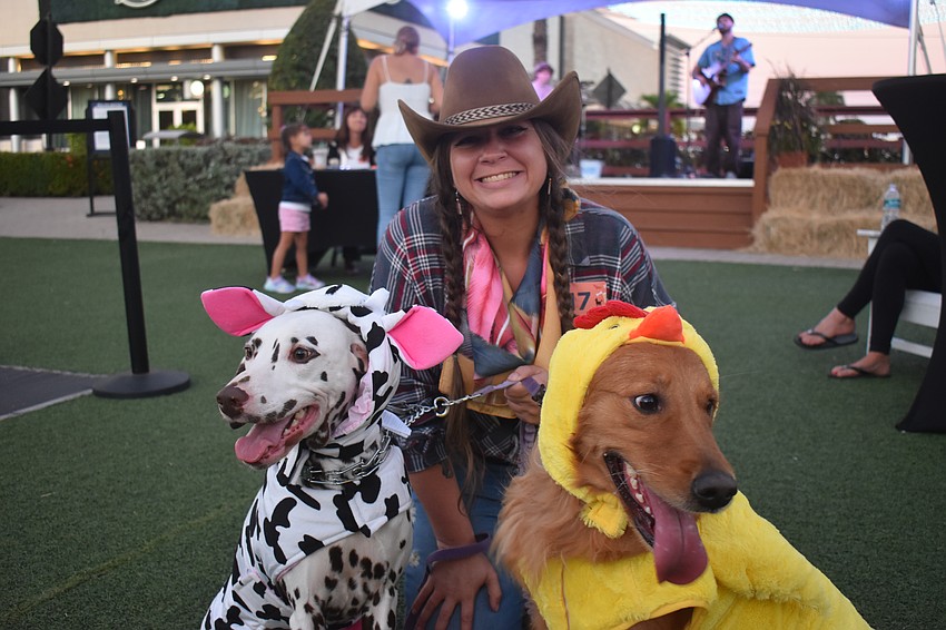 Sarasota's Britteny Boyd says her dogs Dottie the dalmation (cow) and Gracie the golden retriever (chicken) are crazy and get very excited to see people.