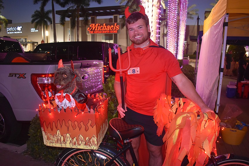 Nokomis resident Casey Jones and his 4-year-old cavapoo named Hubble used a bike decorated with lights and flames to step up the costume.