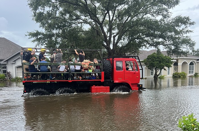 Residents in Summerfield Bluffs are rescued after the Braden River flooded their street following Hurricane Debby in 2024.