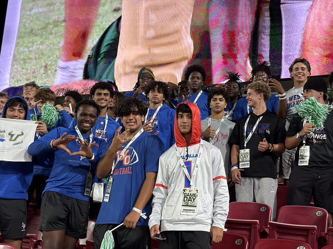 West Orange’s varsity football team gathered together on the end-zone seats at Raymond James Stadium.
