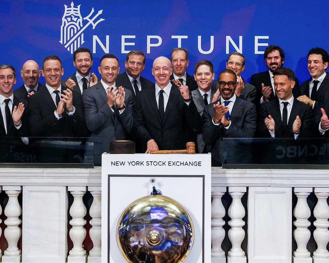 Trevor Burgess, chairman and CEO of St. Petersburg-based insurer Neptune Flood, rings the opening bell for the New York Stock Exchange on Oct. 1, 2025, to celebrate the company's initial public offering.