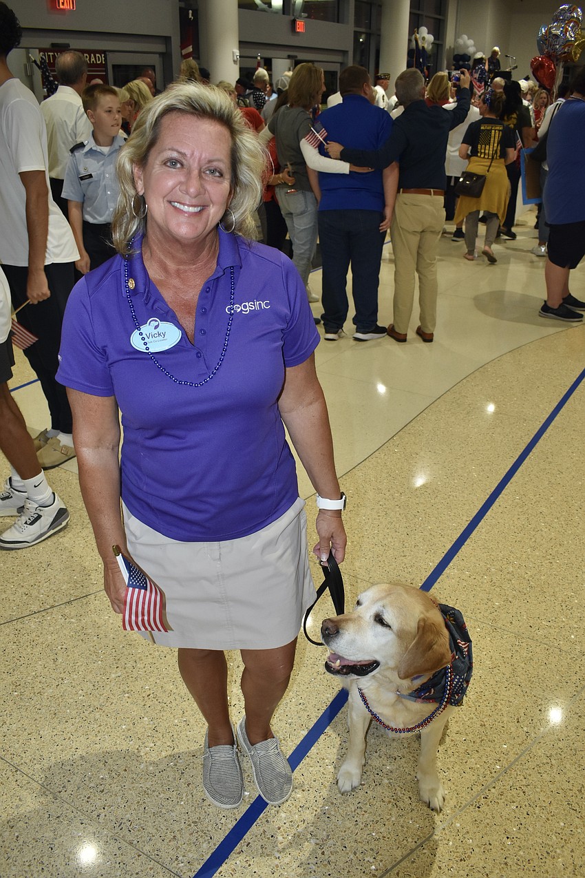 Vicki Cox of Dogs Inc. brought Keni, a retired seeing eye dog named after veteran Keni Thomas.