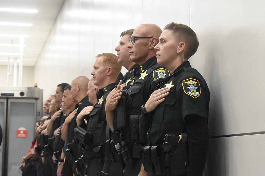 Members of the Sarasota County Sheriff's Office welcome the veterans home.