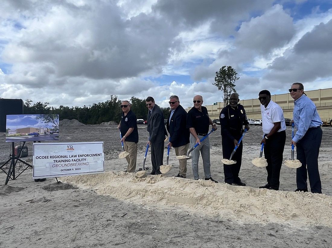Ocoee Commissioners Richard Firstner, Scott Kennedy, Mayor Rusty Johnson, Ocoee Police Chief Vince Ogburn, Commissioner George Oliver III and Chip Cordesfrom Fortress Secured turned the dirt, celebrating the groundbreaking of the training facility.