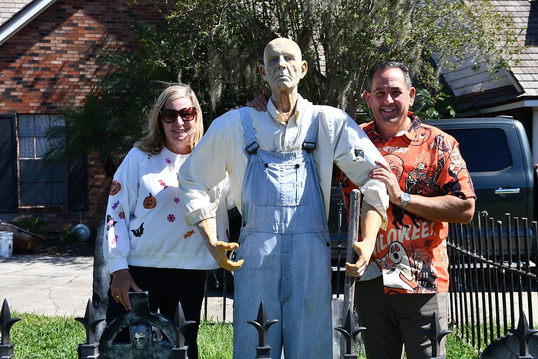 The Allens have signs and decorations ready to go in their front yard.