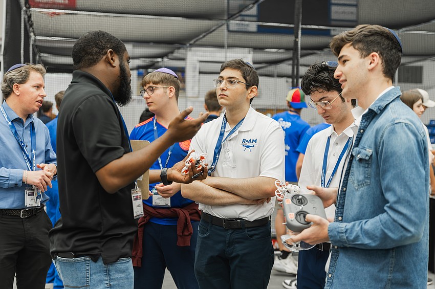 Ryan Bazil mentors students as part of FPL’s Drones in Schools program. Courtesy photo