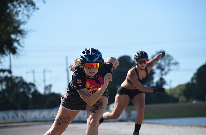 Brooke Pavek (left) and Xochitl Napoles (right) skate down the path at Nathan Benderson Park on Oct. 18. Both will be active in this year's marathon.