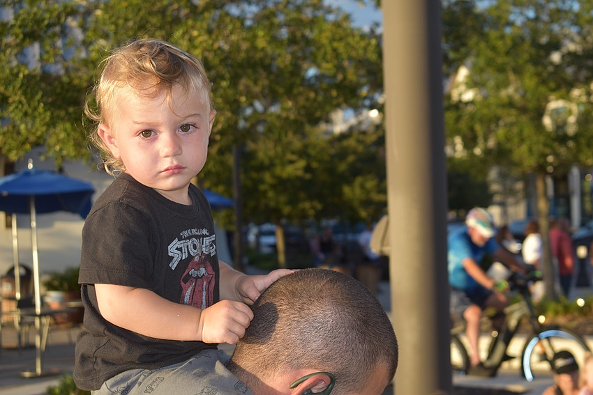 Lakewood Ranch's 2-year-old Caine Miyares gets a good seat — on his dad Chris Miyares' shoulders.
