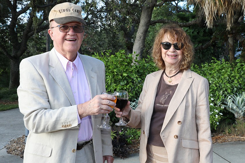 Larry and Carole Wickless toast to Safari Sarasota during the cocktail reception.