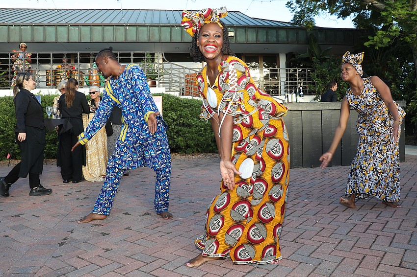 Dancers Mosi, Lala and Alake entertain during the cocktail reception.