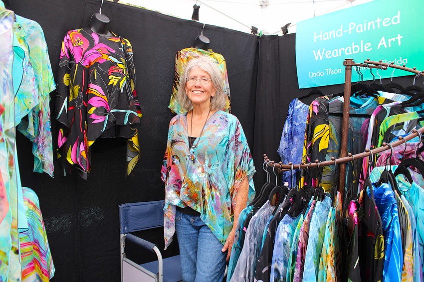 Fabric artist Linda Tilson uses mineral-based dyes to handcraft her silk and rayon pieces. She said customers appreciate the lightness and versatility of her clothing.