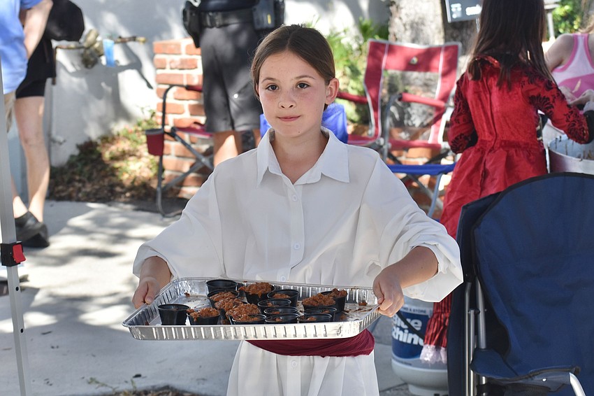 The day of the competition, 9-year-old Ellie Bowlin helped dish up portions of chili for Longboat's 