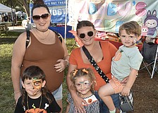Noah Roman, 5, his mother Kiersten Perez,  Salem Friday, 4, her mother Tabitha Lenz, and brother Teddy Friday, 2, came dressed for the season.