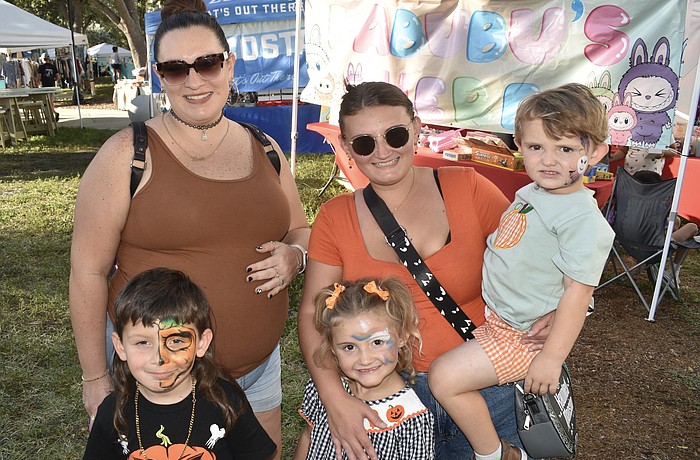 Noah Roman, 5, his mother Kiersten Perez,  Salem Friday, 4, her mother Tabitha Lenz, and brother Teddy Friday, 2, came dressed for the season.