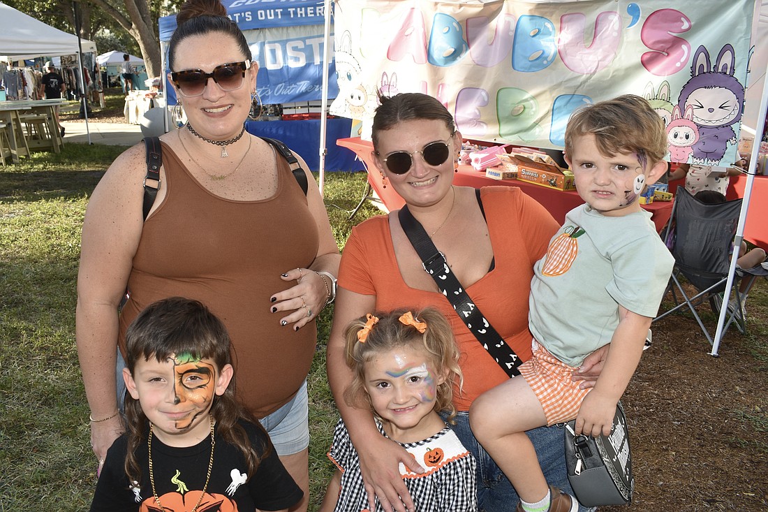 Noah Roman, 5, his mother Kiersten Perez,  Salem Friday, 4, her mother Tabitha Lenz, and brother Teddy Friday, 2, came dressed for the season.