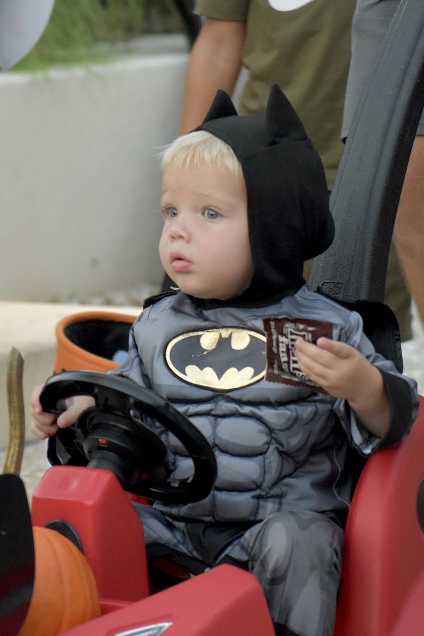 Maverick Mathis, 1, heads down the trail with his family.