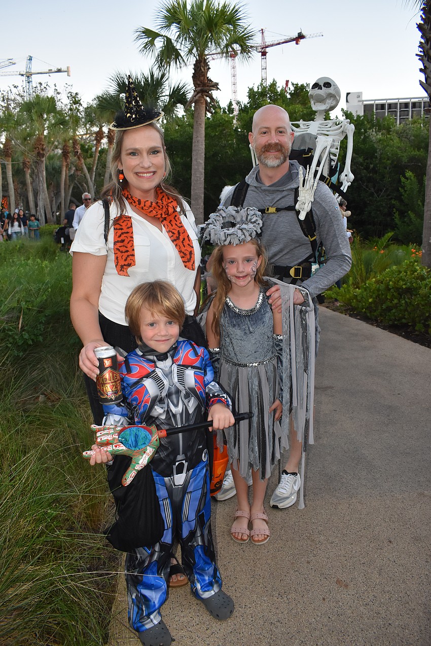 William Howarth, 7, his mother Ilysa Howarth, sister Huxley Howarth, 7 and father Jeremy Howarth stand on the trail.
