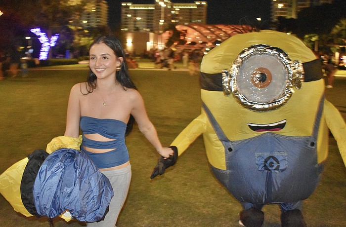 Leisa Wilhelm leads her boyfriend Austin Bronkhorst across the park.